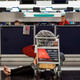 A traveler rests at a check-in counter at Hong Kong’s airport on Aug. 12, 2019.